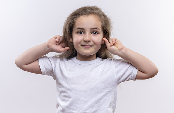 young girl with glasses looking up