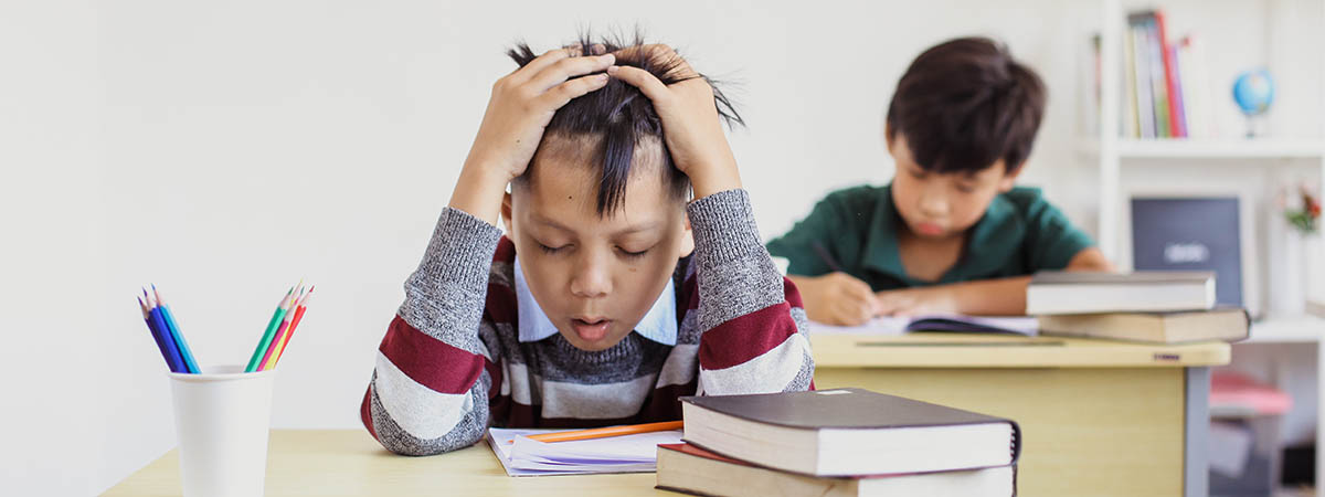 frustraded boy in classroom