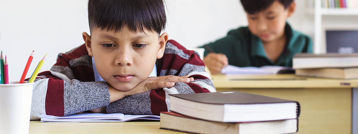 boy distracted in classroom